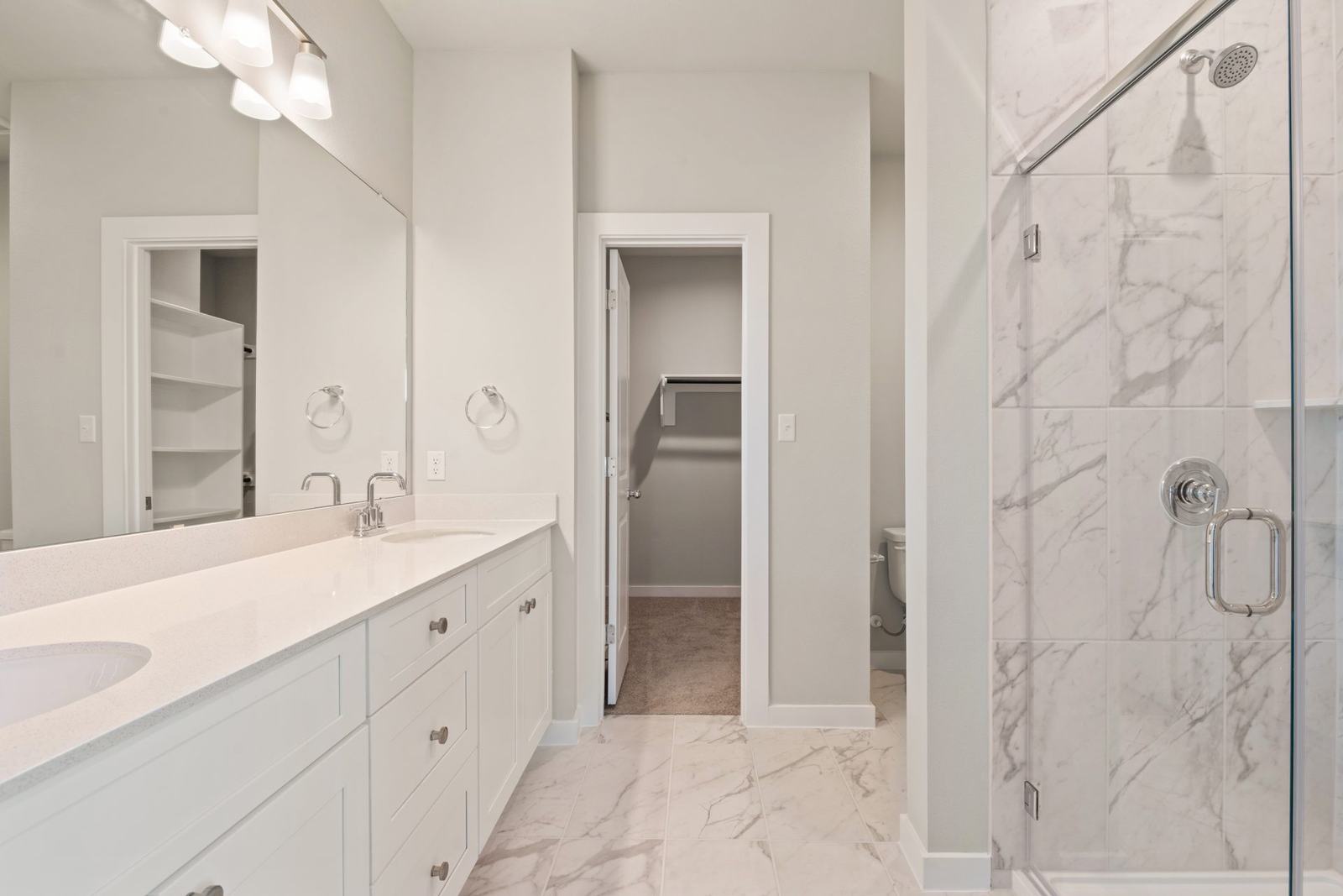 Keystone Homes primary bath with marble tile
