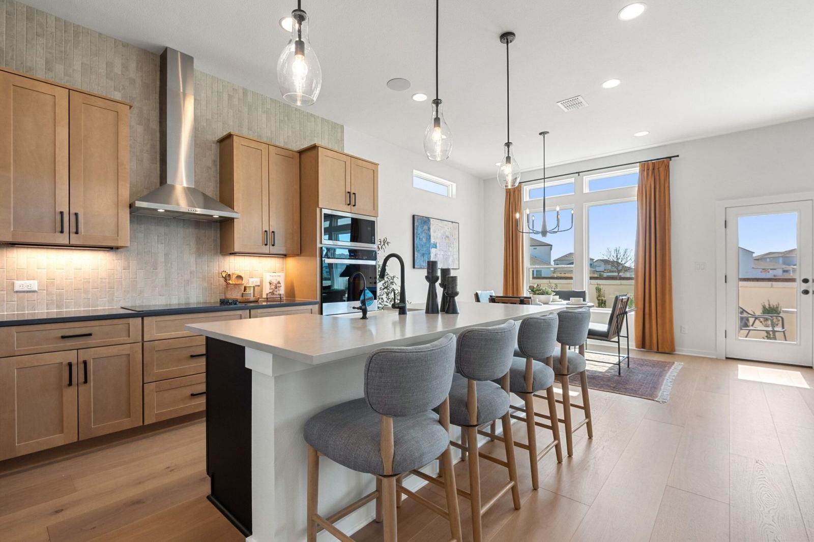Keystone Homes kitchen with island and warm wood cabinetry
